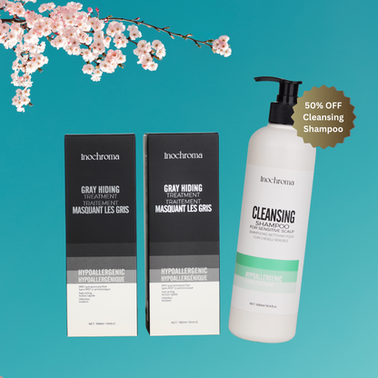 Inochroma hair care products including shampoo and treatment on a teal background with cherry blossoms.