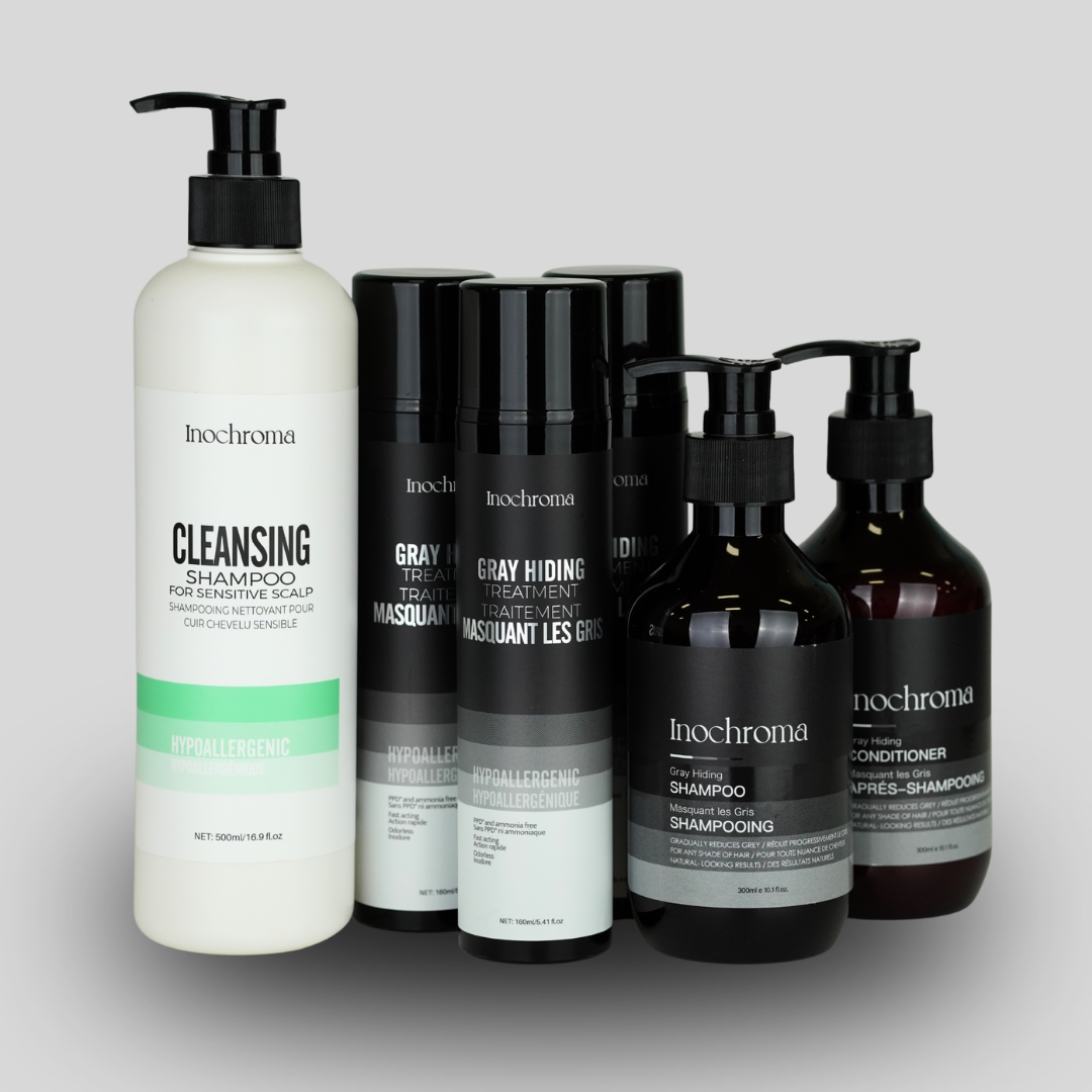 Inochroma hair care product bottles on a gray background
