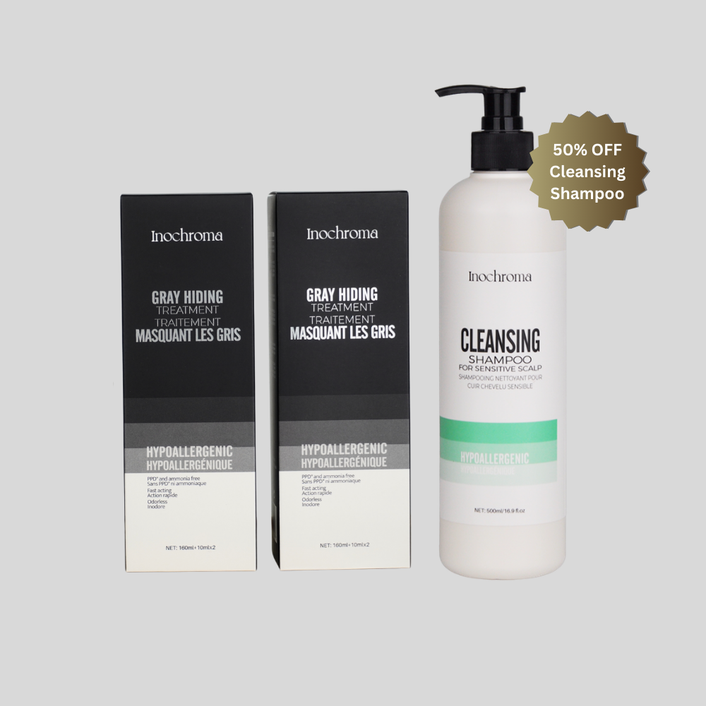 Inochroma hair care products including shampoo and treatment boxes on a light gray background